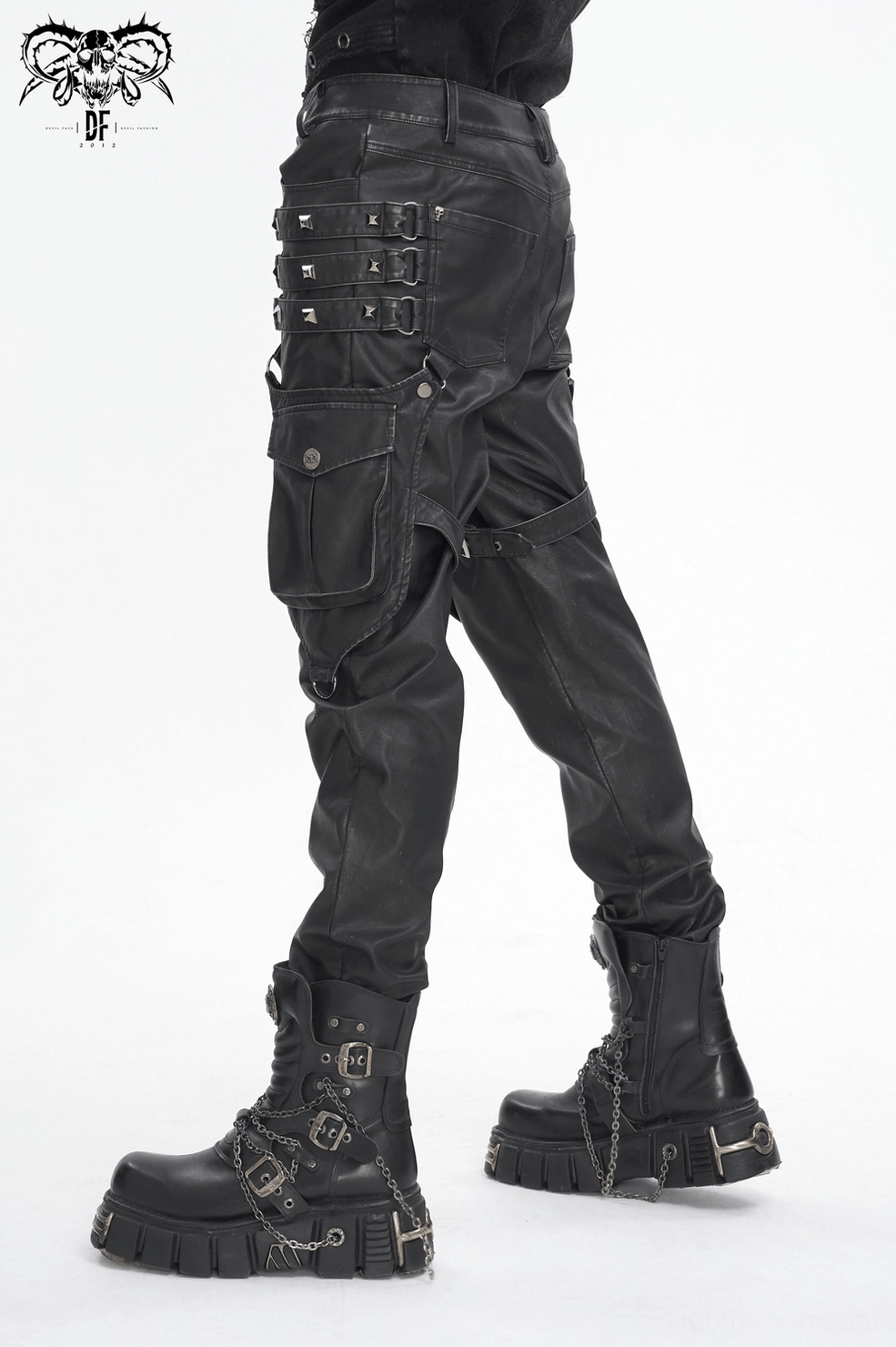 Black cargo pants lower leg detail highlighting metal straps, rivets, utility pockets, and rugged gothic fashion construction
