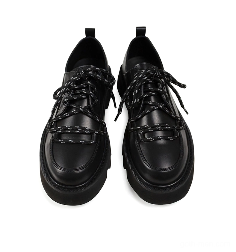 Black platform leather derby shoes top-down flat lay showing chunky sole and lace configuration