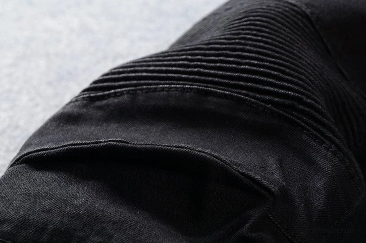 Black pleated biker jeans knee detail - ribbed pleated texture on moto denim