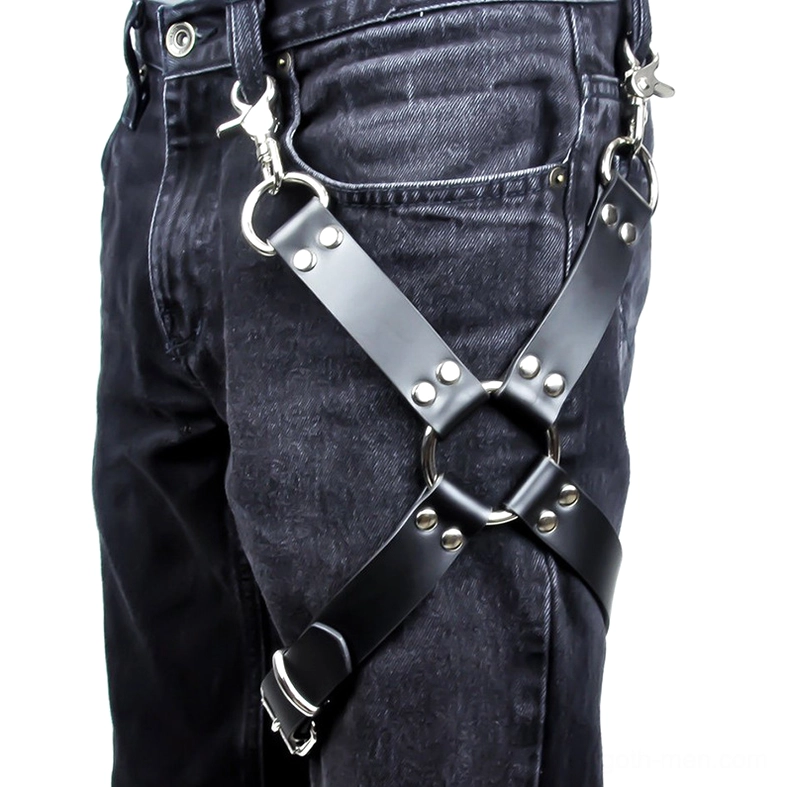 Black PU leather leg harness with geometric crisscross straps and silver rivets, detailed side view on denim