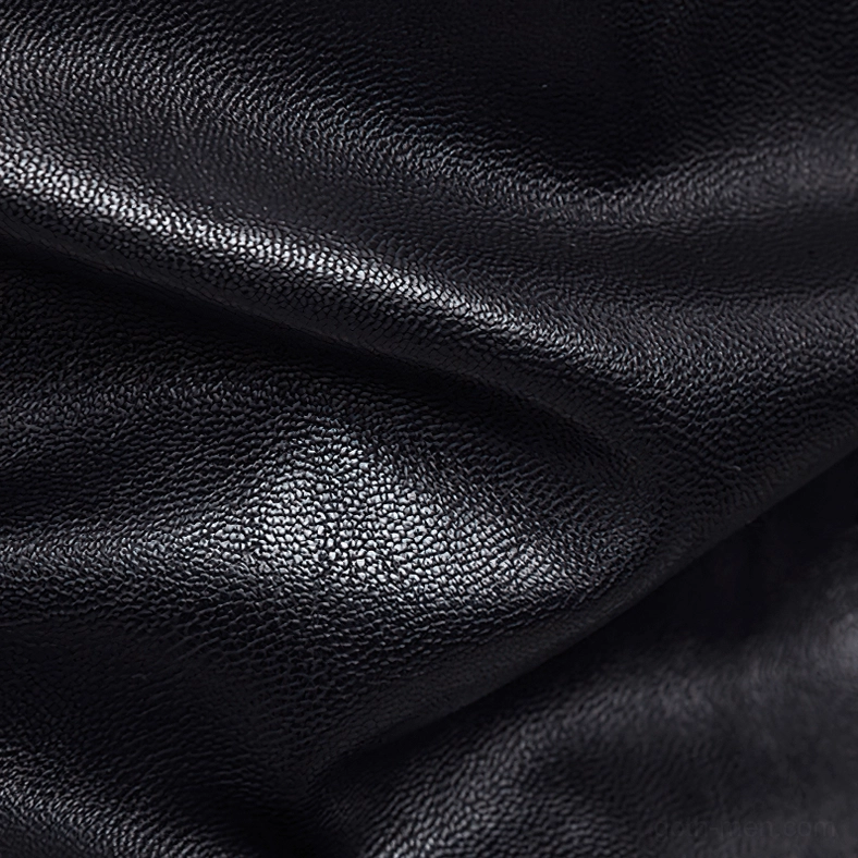 Texture detail of grainy black PU faux leather surface on gothic biker jacket