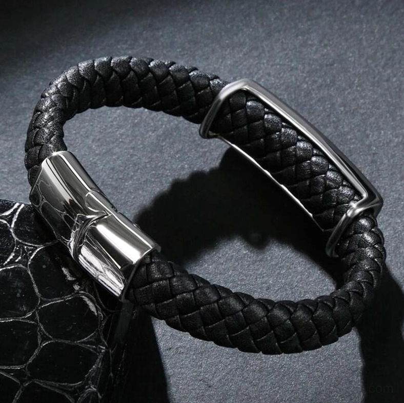 Black leather punk bracelet with matte stainless steel clasp, oblique side view demonstrating wrap style design