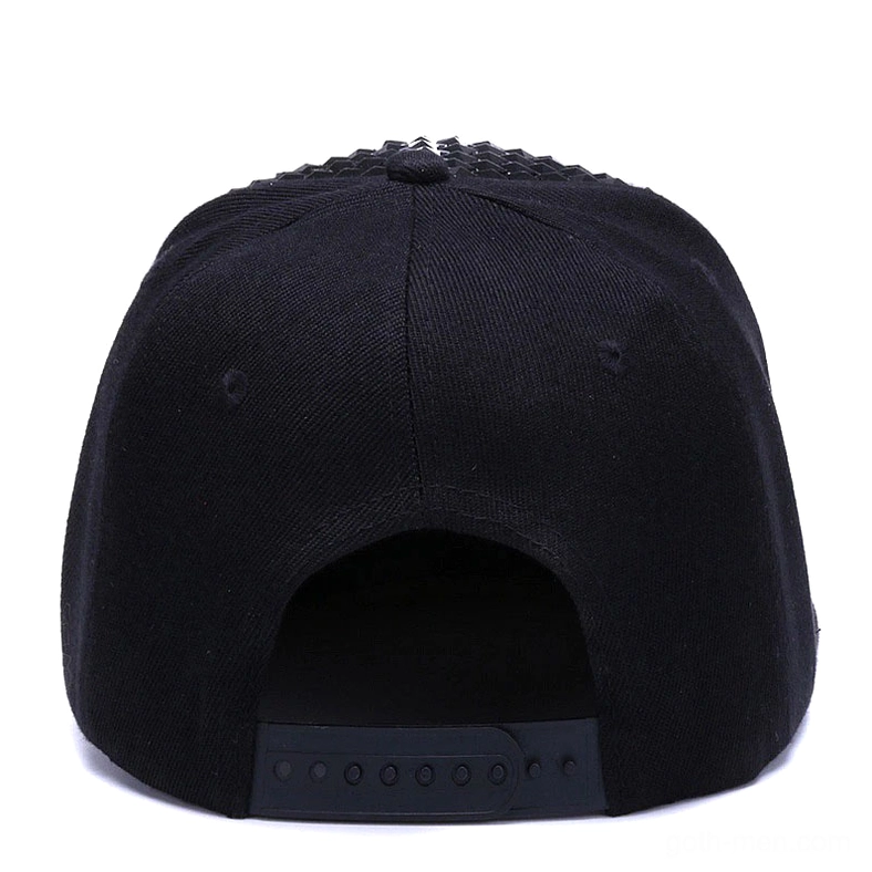 Black pyramid studded snapback cap close-up showing metallic stud texture and reflectivity