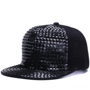 Solid black pyramid studded snapback cap with full metallic spike coverage, front view