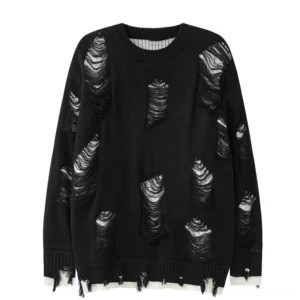 Black distressed oversized knit sweater with ripped patch designs and frayed hem - front flat lay product shot