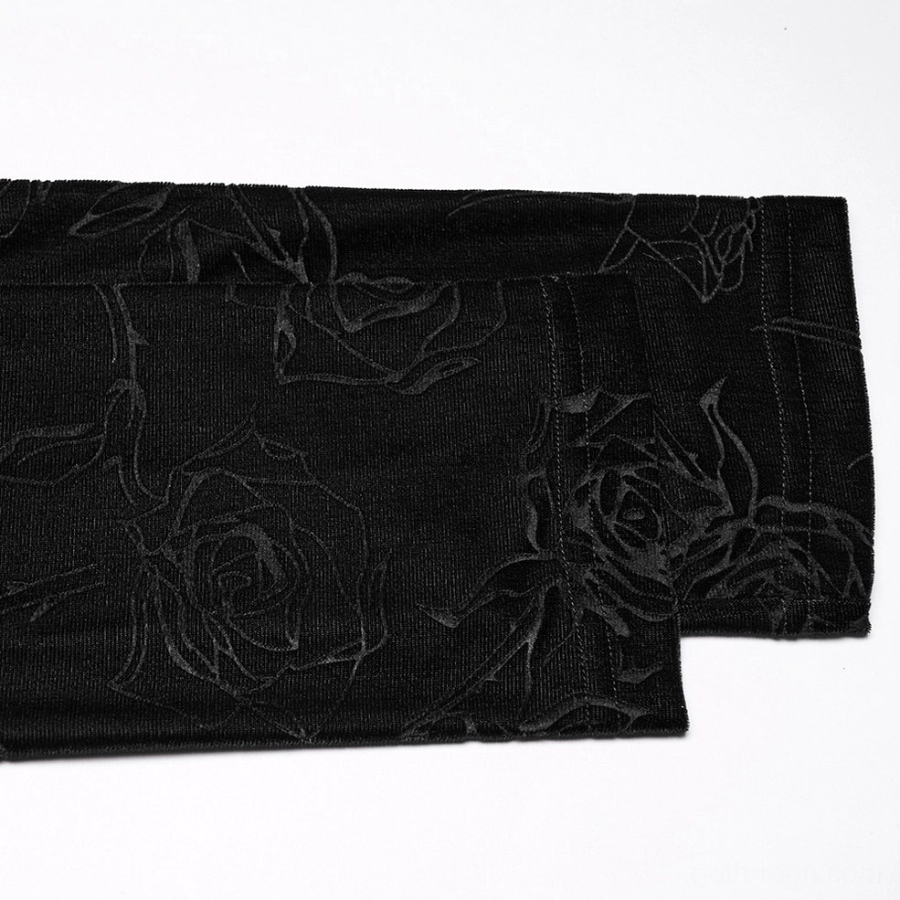 Close-up texture detail of black rose embossed velvet fabric - three-dimensional embossed rose pattern surface