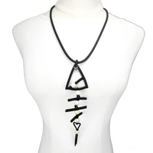 Black rubber fish bone gothic pendant necklace with pearl accents on white display mannequin - front view