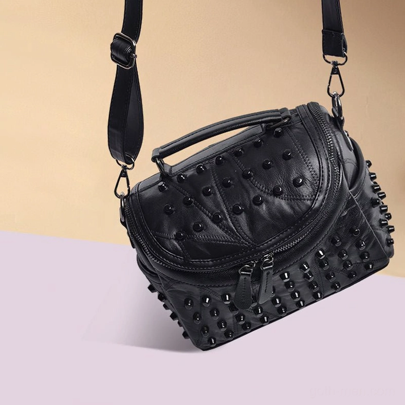 Gothic black leather messenger satchel featuring premium sheepskin material and metal stud embellishment