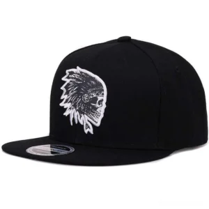Black cotton snapback cap with white embroidered skull logo, front three-quarter view showing flat brim structure