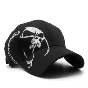 Black gothic skull baseball cap with white embroidered skull design, three-quarter front view showcasing detailed embroidery work