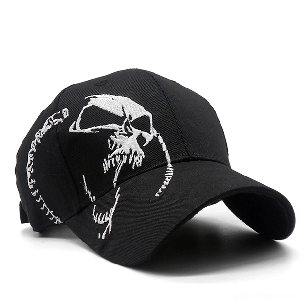 Black gothic skull baseball cap with white embroidered skull design, three-quarter front view showcasing detailed embroidery work