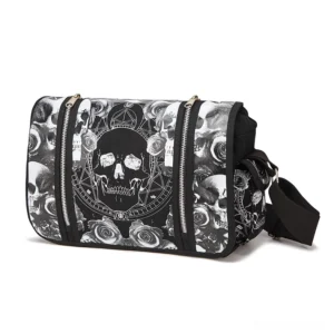 Black gothic skull canvas crossbody bag with dual zippers, front three-quarter view showing printed rose and skull pattern