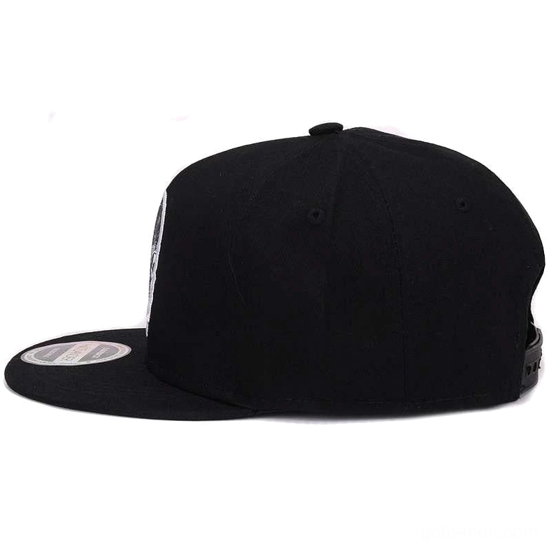 Black snapback cap showing adjustable snap closure and flat brim design, side rear view