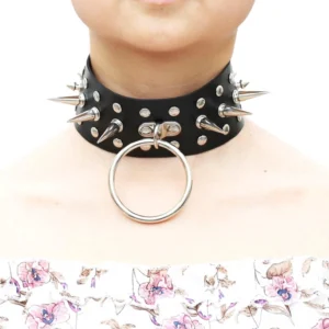 Black oversized spiked choker on model wearing floral top, close-up front view showing metal spike and O-ring detail