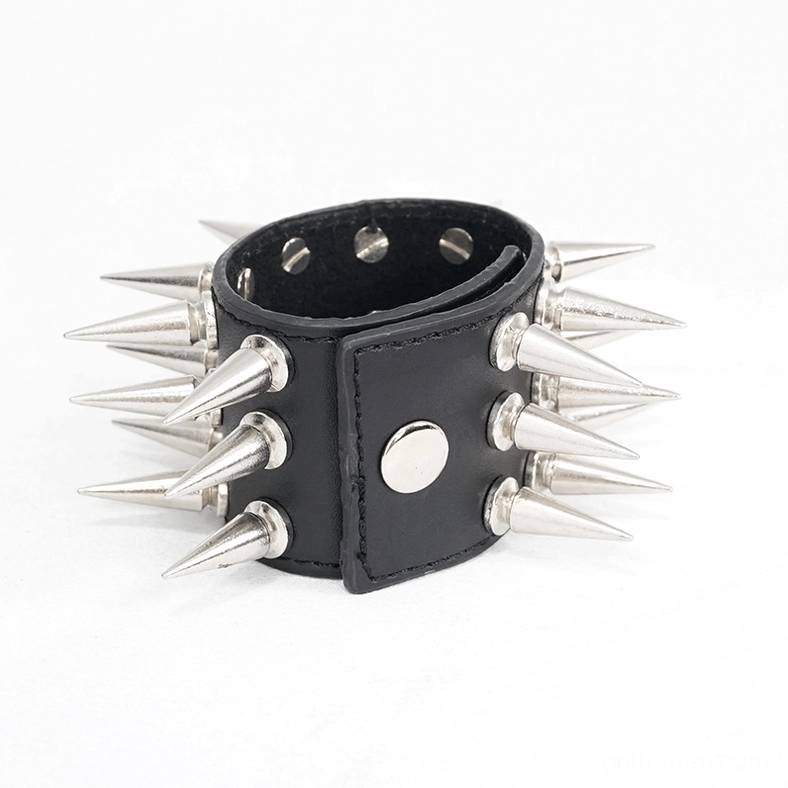 Black leather spiked bracelet side view highlighting multiple silver cone spikes and snap closure