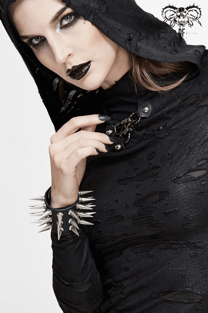 Black spiked leather bracelet metal snap button closure and leather band construction detail
