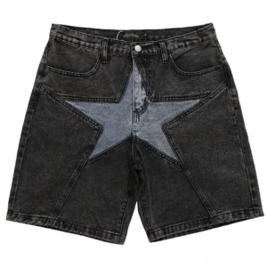 Black denim shorts with light blue star patchwork panels, front flat lay shot showcasing alternative gothic style