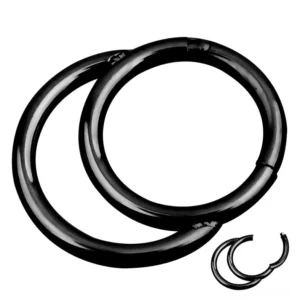 Black surgical steel hinged segment nose clicker ring close-up detail shot showing clicker mechanism