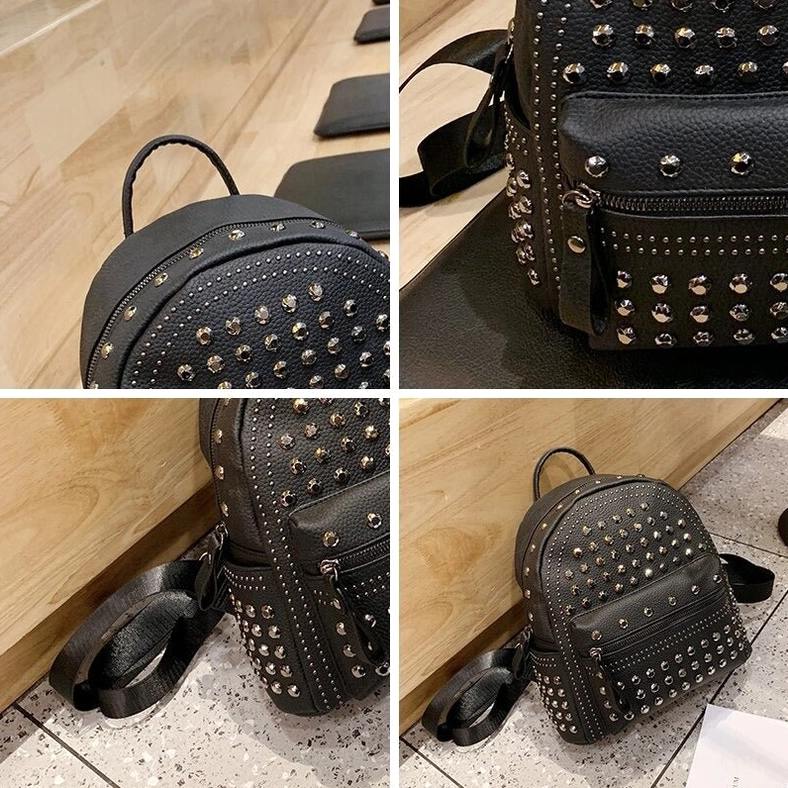 Top view of black gothic backpack showing handle and upper rivet decoration details