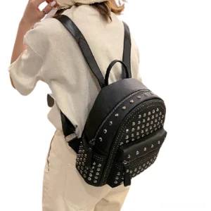 Women wearing black studded gothic backpack side view demonstrating daily wear comfort and style