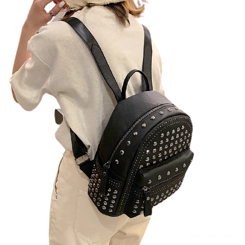 Women wearing black studded gothic backpack side view demonstrating daily wear comfort and style