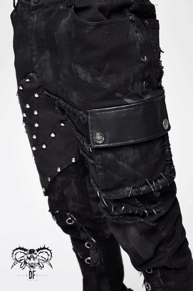 Black gothic cargo pants flat lay showing overall silhouette and distressed fabric pattern