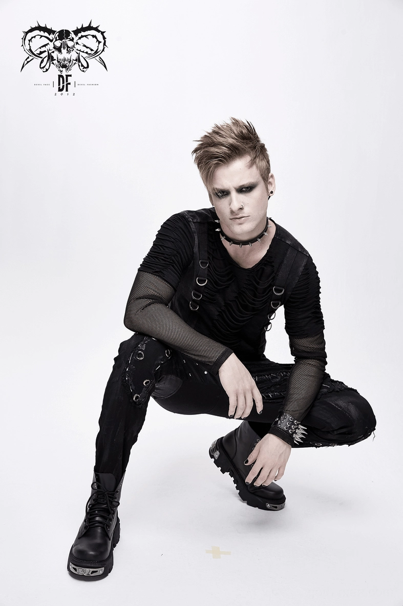 Black punk rock studded cargo pants laying flat emphasizing slim tapered design