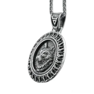 Black Sun Wolf Slavic Amulet Pendant oblique side view showing embossed wolf head and radiating sun ray border in antique silver stainless steel