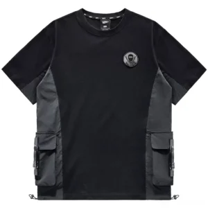 Black tactical cargo t-shirt front view with multi-pockets, chest patch, and dark gray color blocking detail shot