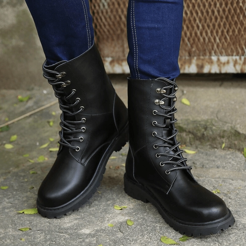 Black tactical combat boots full length view, mid-calf silhouette with cow suede lining and aggressive tread rubber sole for all-day wear