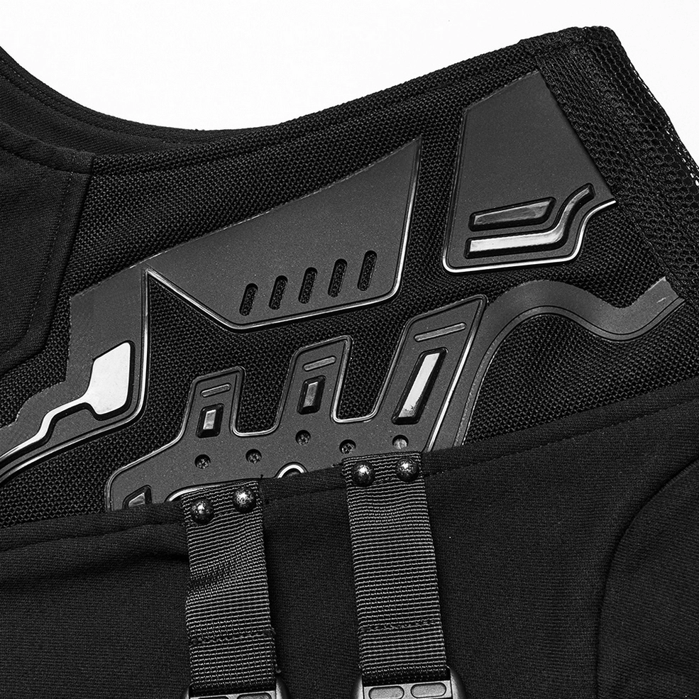 Close-up macro shot of black rubber armor panel on shoulder with webbing straps and metal rivets