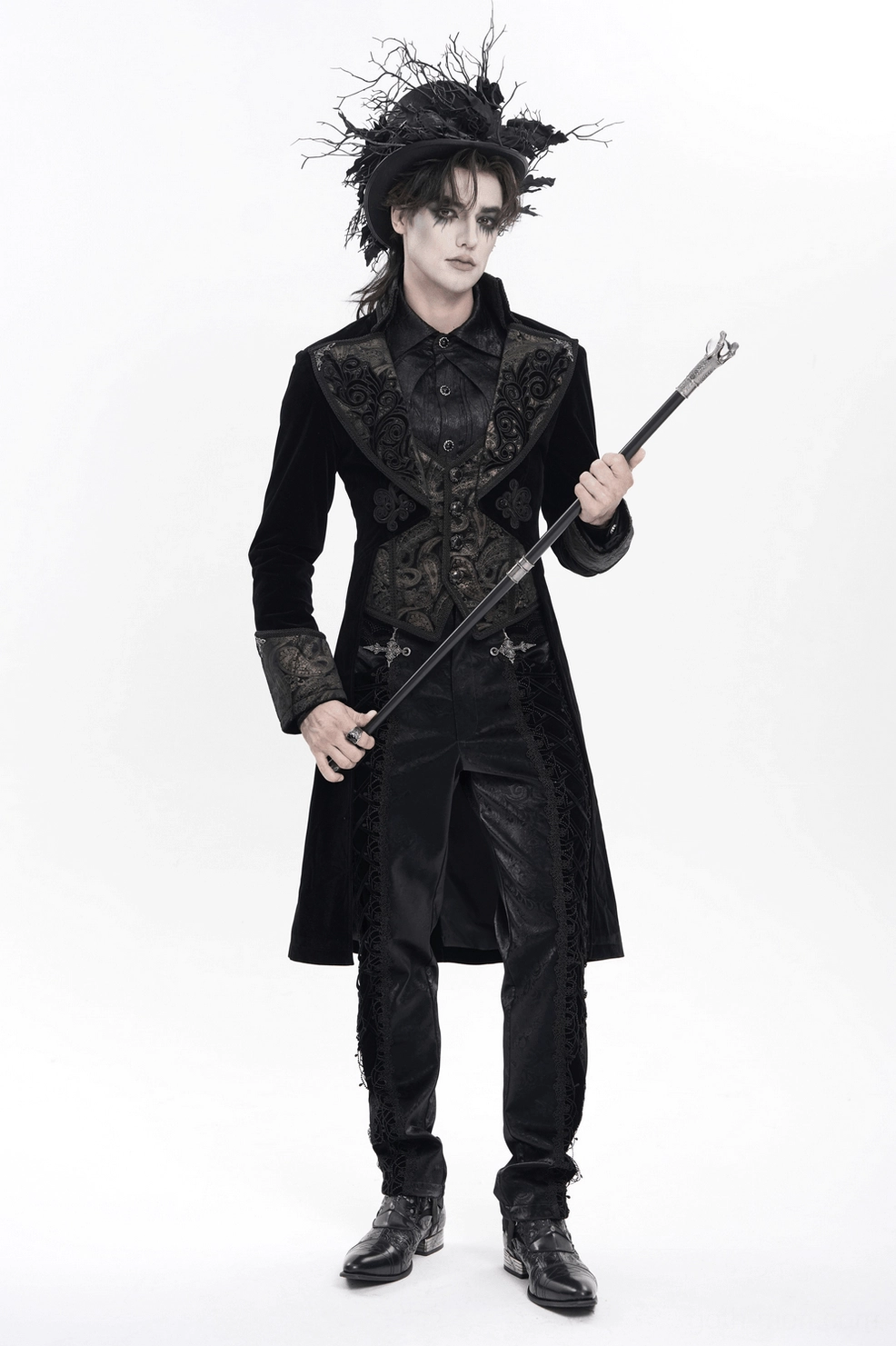 Black gothic tailcoat back detail focus on embroidered waist and extended train hem design