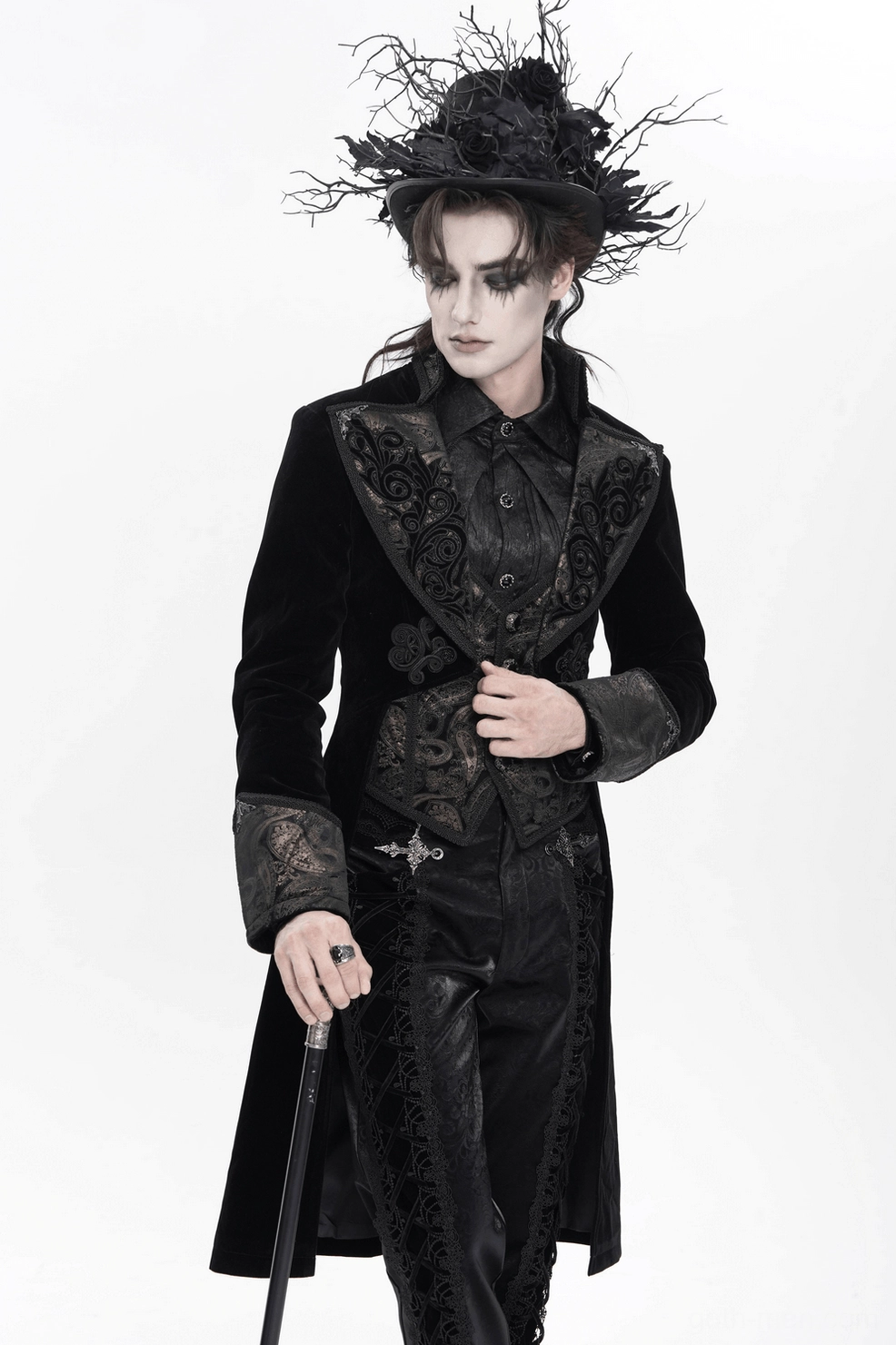 Black velvet tailcoat side view showing baroque embroidery placement and structure