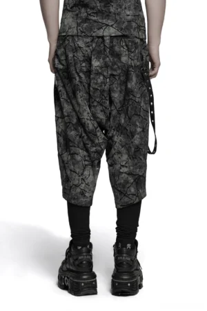 Black cracked tie-dye harem pants rear view displaying drop crotch cut and side eyelet strap details