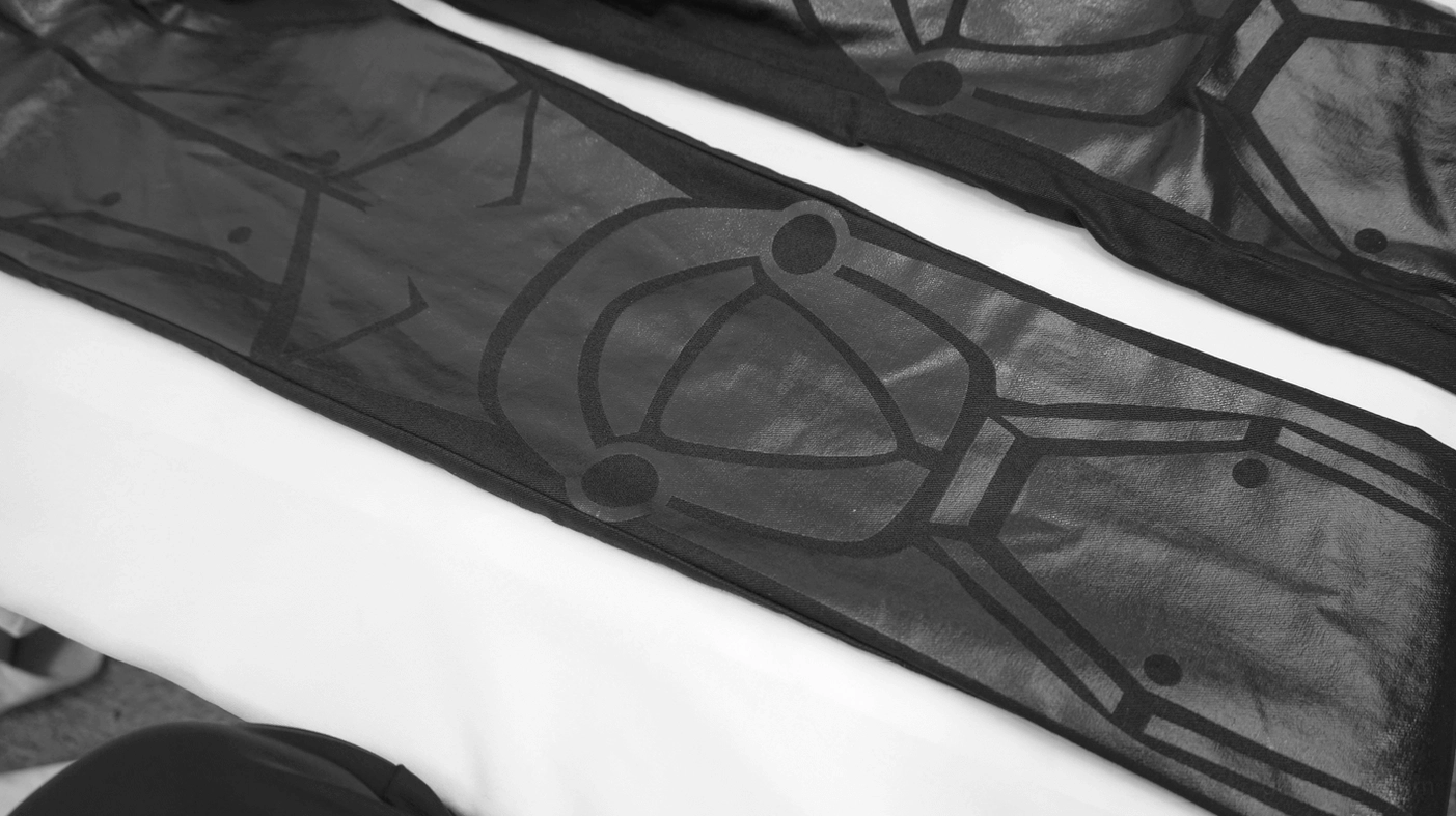 Close-up detail of PU splicing pattern showing contrasting matte and glossy finishes