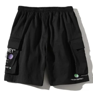 Solid black utility shorts with drawstring waist and printed cargo pockets - studio flat lay