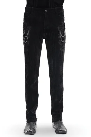 Black velvet gothic slim fit pants with embroidered cross and silver chain details - front full view on male model