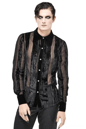 Front view of black velvet gothic shirt with sheer stripe panels worn by male model with gothic makeup against white studio background