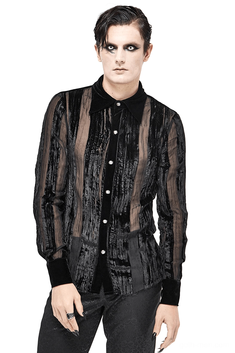 Front view of black velvet gothic shirt with sheer stripe panels worn by male model with gothic makeup against white studio background