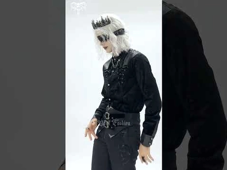 Gothic velvet shirt styled with leather waist belt, cross pendant chain jewelry, and matching accessories on model