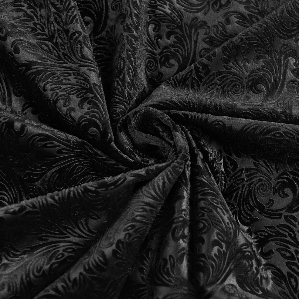Three-quarter view of black gothic velvet shirt with leather trim and lace-up front on styled male model