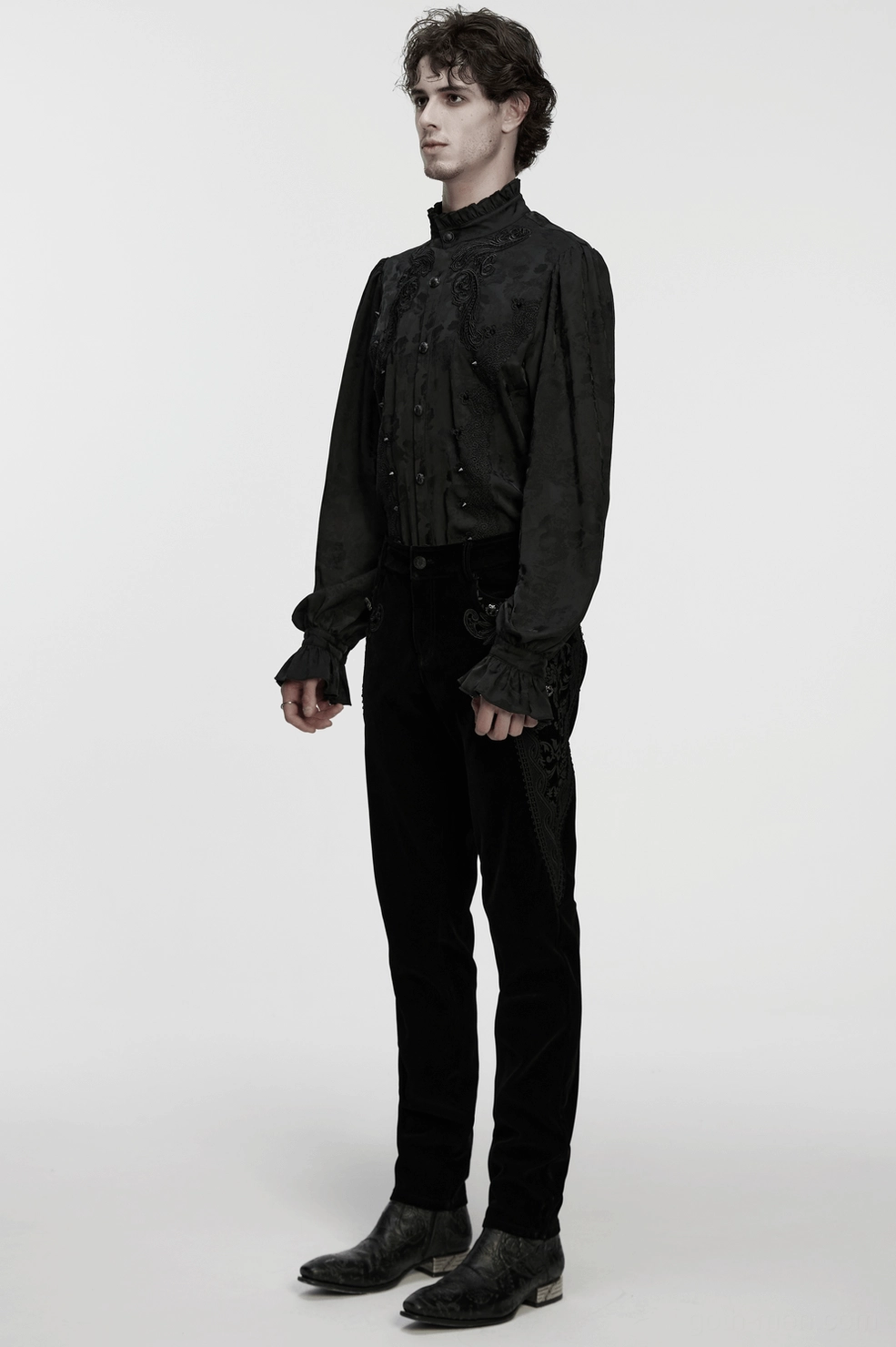 Black velvet gothic pants full view showing slim-fit silhouette and complete ornate embroidery design