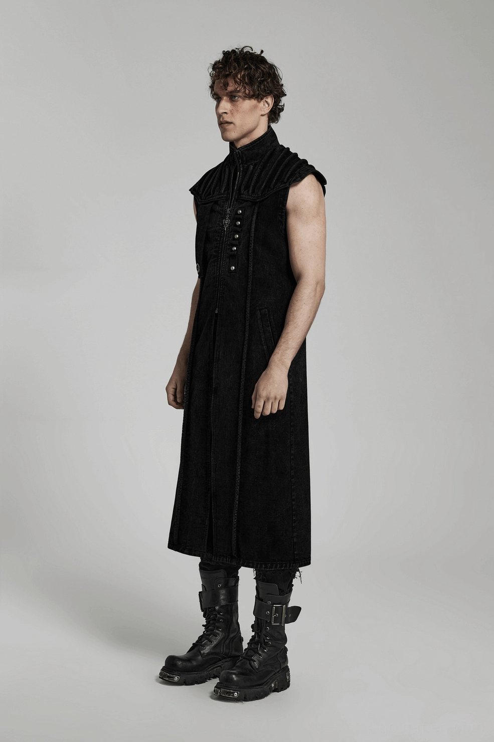 Black distressed denim gothic vest showing authentic wear patterns and industrial aesthetic