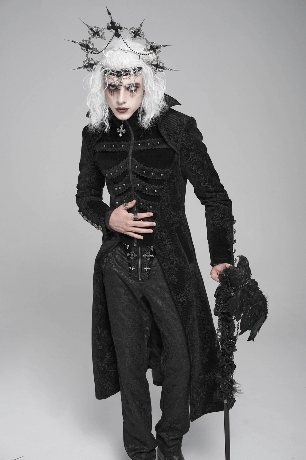 Black brocade Victorian gothic tailcoat full front view on model, presenting classic goth silhouette with ornate details