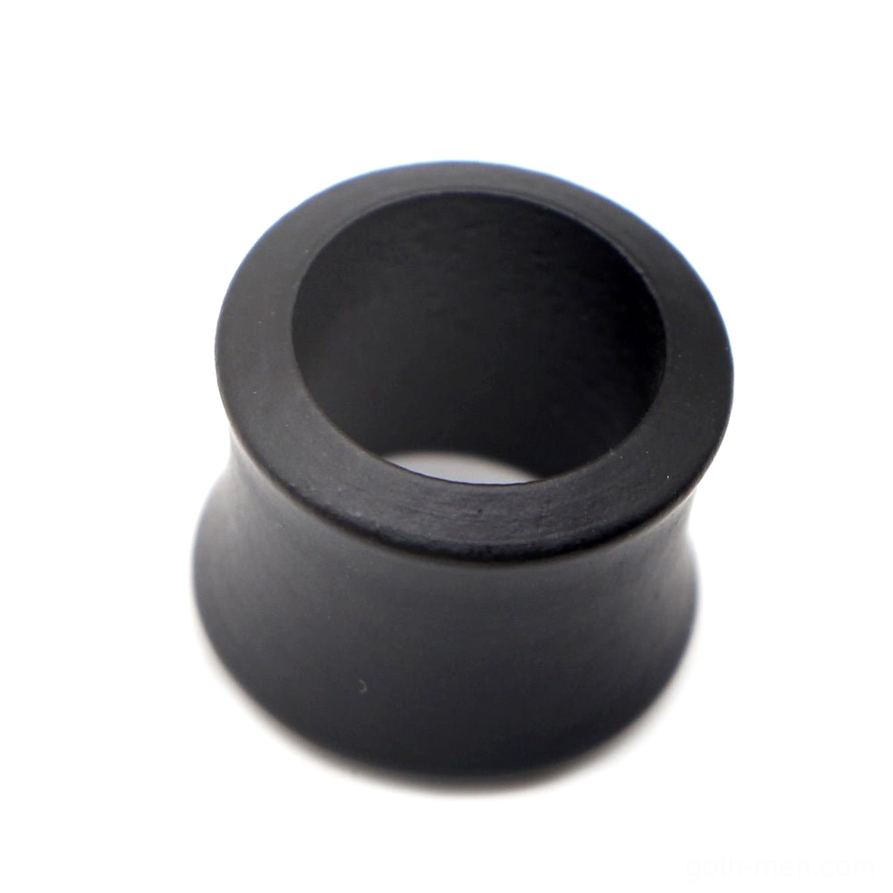 Black wood ear stretchers paired display showing multiple tunnel plugs in natural lighting