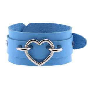 Blue double-layer leather heart cuff bracelet with silver hollow heart metal decoration, front flat lay gothic accessories