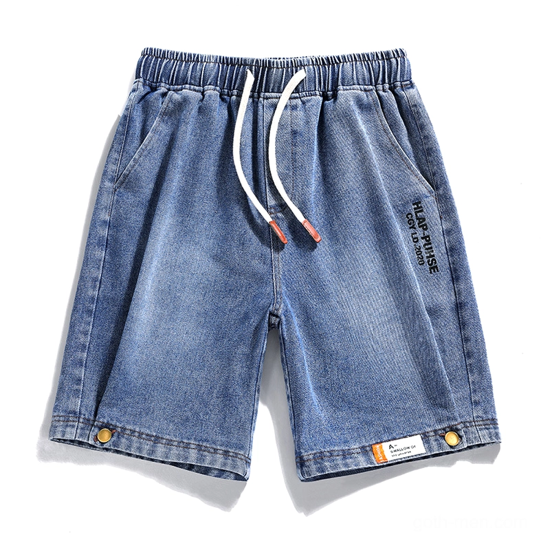 Blue loose denim shorts for men showing drawstring waist and buttoned cuffs, flat lay display