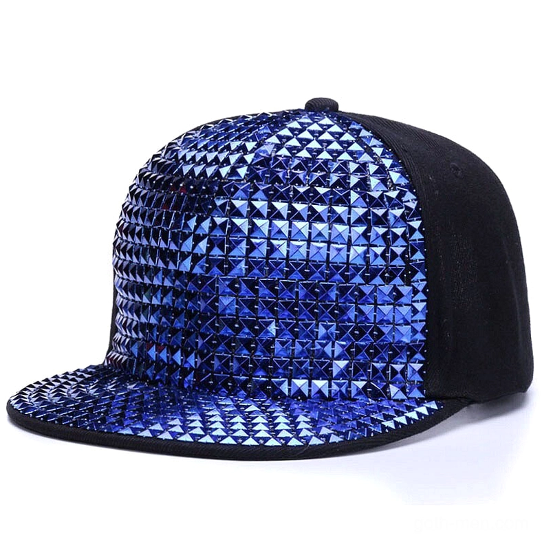 Bright blue metallic pyramid studded flat-brim cap, side front view showcasing stud detail