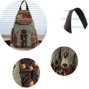 Hand-embroidered patterned flap detail with woven tassel and wooden bead accents - bohemian gothic canvas backpack closeup