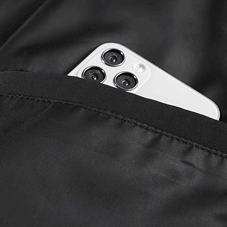 Stretchy ribbed pocket opening detail on gothic tactical bomber - nylon fabric trim close-up